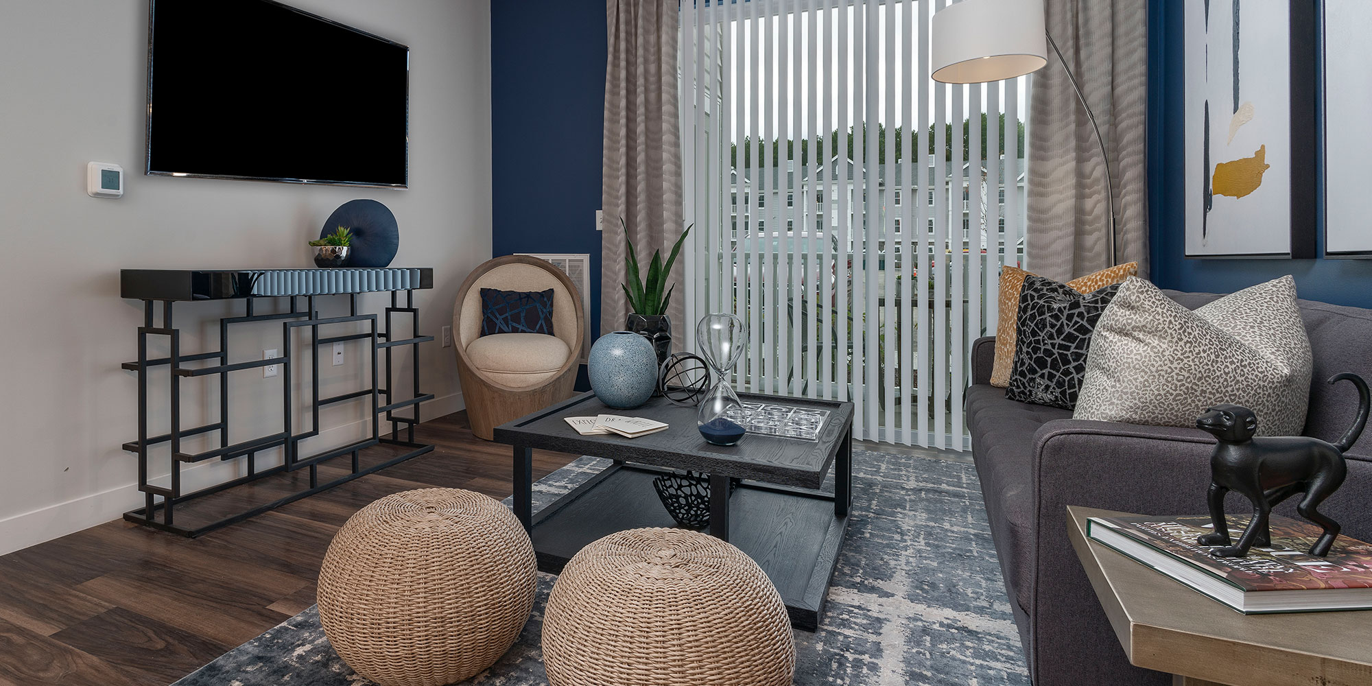 Furnished living room and patio in luxury apartment at Maynard Crossing