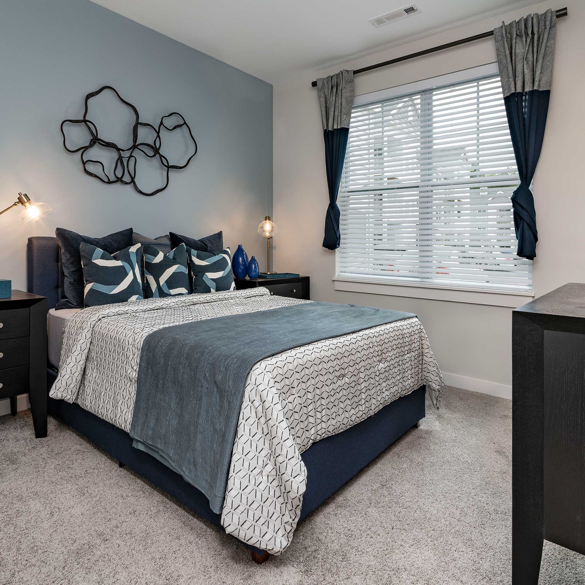 Bedroom with Queen bed and dresser at Halstead Maynard Crossing