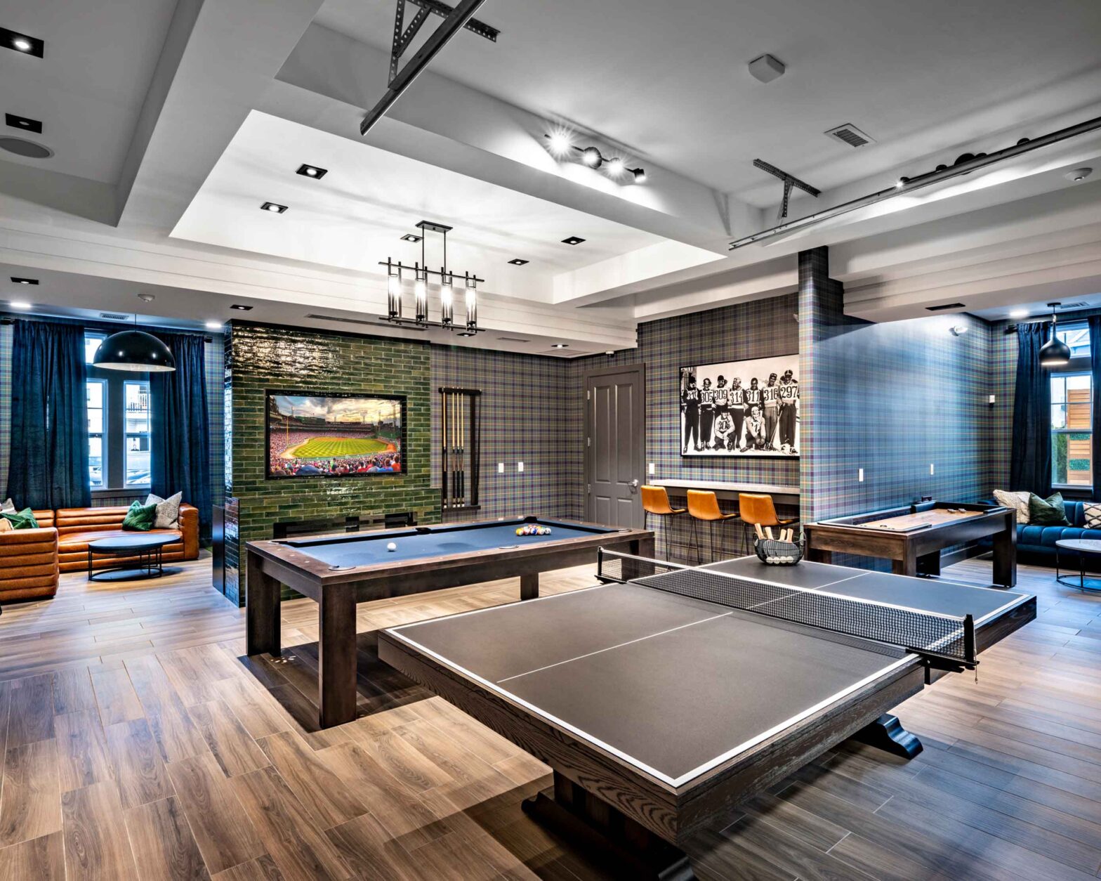Clubhouse with pool table and televisions luxury amenity for residents